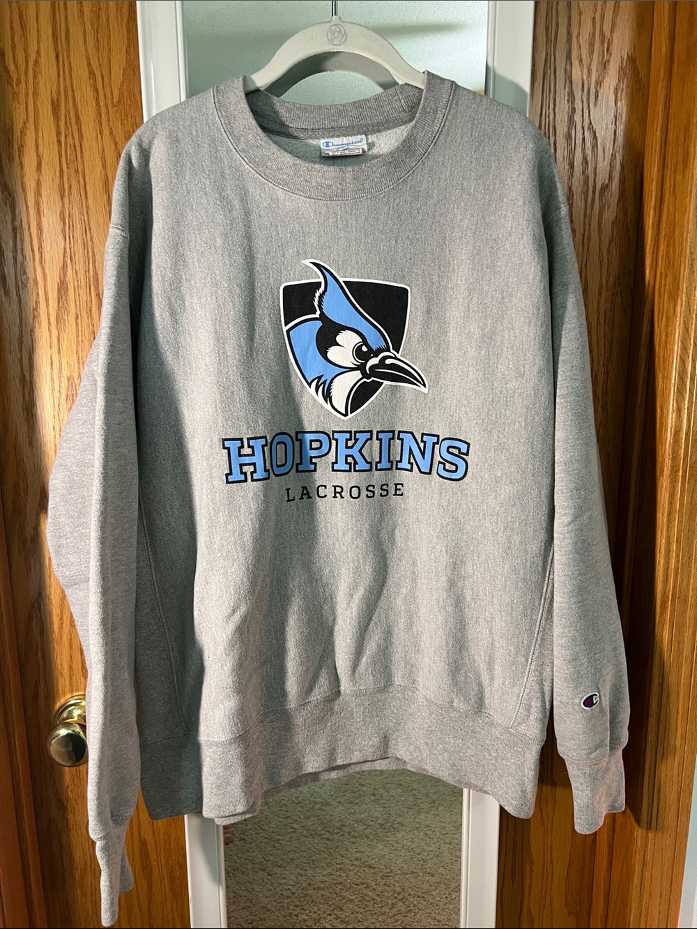 Champion Gray Crewneck with Blue Hopkins Lacrosse Logo